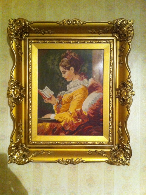 Cross-stitch girl with book