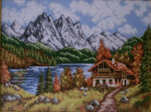 mountain lake with house