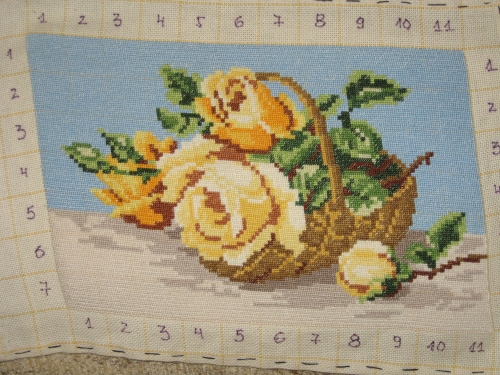Cross-stitch basket with yellow roses
